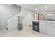 Open kitchen with tile flooring and stainless steel appliances at 611 2Nd Ave. S # 18-C, North Myrtle Beach, SC 29582