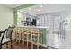 Open kitchen with bar seating, granite countertops, and modern appliances at 611 2Nd Ave. S # 18-C, North Myrtle Beach, SC 29582