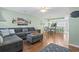 Comfortable living room open to the dining area and kitchen with hardwood floors at 611 2Nd Ave. S # 18-C, North Myrtle Beach, SC 29582