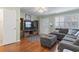 Spacious living area with entertainment center, hardwood floors, and natural light at 611 2Nd Ave. S # 18-C, North Myrtle Beach, SC 29582
