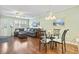 Open concept living and dining area with stylish decor and hardwood floors at 611 2Nd Ave. S # 18-C, North Myrtle Beach, SC 29582