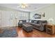 Cozy living room with a comfortable sectional sofa, ceiling fan, and ample natural light at 611 2Nd Ave. S # 18-C, North Myrtle Beach, SC 29582