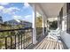 Charming balcony with wrought iron railing and comfortable seating, offering views of the neighborhood at 611 N Ocean Blvd., Surfside Beach, SC 29575