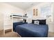 Nautical-themed bunk room featuring a twin bunk over a queen bed and coastal decorations at 611 N Ocean Blvd., Surfside Beach, SC 29575