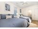 Spacious bedroom featuring two queen beds, coastal-themed decor, and a well-lit, inviting atmosphere at 611 N Ocean Blvd., Surfside Beach, SC 29575