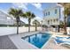 Inviting community pool with lounge chairs, steps, and shallow water at 611 N Ocean Blvd., Surfside Beach, SC 29575
