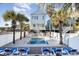Community pool with lounge chairs and well-kept grounds at 611 N Ocean Blvd., Surfside Beach, SC 29575
