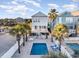 Inviting community pool with lounge chairs and surrounding beach houses at 611 N Ocean Blvd., Surfside Beach, SC 29575