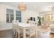 Elegant dining room with a large table, pendant lighting, and a comfortable seating area for Gathering gatherings at 611 N Ocean Blvd., Surfside Beach, SC 29575