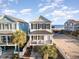 Beautiful two-story beach house with a front porch, with nearby parking and ocean views at 611 N Ocean Blvd., Surfside Beach, SC 29575
