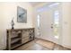Welcoming foyer with stylish console table, coastal decor, and ample natural light, creating a warm entry at 611 N Ocean Blvd., Surfside Beach, SC 29575