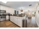 Open-concept kitchen flowing into a spacious living area, featuring modern appliances and stylish finishes at 611 N Ocean Blvd., Surfside Beach, SC 29575