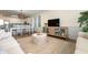 Open concept living room with dining area featuring coastal decor and natural light at 611 N Ocean Blvd., Surfside Beach, SC 29575