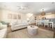Open floor plan showcasing the living room, dining area, and kitchen with a staircase at 611 N Ocean Blvd., Surfside Beach, SC 29575