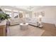 Spacious living room featuring neutral tones, bright windows, and stylish furnishings at 611 N Ocean Blvd., Surfside Beach, SC 29575