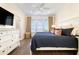 Bedroom featuring a large bed, natural light, and coastal decor with matching dressers at 611 N Ocean Blvd., Surfside Beach, SC 29575