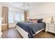 This bright main bedroom features a coastal view from large windows and stylish decor for a relaxing retreat at 611 N Ocean Blvd., Surfside Beach, SC 29575