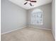 Empty bedroom with a large window with plantation shutters and a ceiling fan at 612 Intracoastal Way Dr. # 103, Myrtle Beach, SC 29579