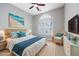 Staged bedroom with beach themed decor, large window and ceiling fan at 612 Intracoastal Way Dr. # 103, Myrtle Beach, SC 29579