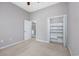 Bright bedroom featuring neutral paint, ceiling fan, and access to a bathroom and closet at 612 Intracoastal Way Dr. # 103, Myrtle Beach, SC 29579