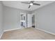 Neutral bedroom with ceiling fan, carpet, and access to the bathroom and another room at 612 Intracoastal Way Dr. # 103, Myrtle Beach, SC 29579