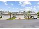 Charming townhomes with attached garages, lush landscaping, and pristine white siding at 612 Intracoastal Way Dr. # 103, Myrtle Beach, SC 29579