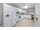 Bright kitchen with white appliances, ample storage, granite counters, and access to dining at 612 Intracoastal Way Dr. # 103, Myrtle Beach, SC 29579