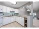 Charming kitchen features granite countertops, backsplash, and white cabinetry with breakfast bar at 612 Intracoastal Way Dr. # 103, Myrtle Beach, SC 29579