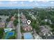The aerial view shows a community with tennis courts, swimming pool, and ocean in the distance at 614 14Th Ave. S # 47, Surfside Beach, SC 29575