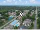 The aerial view shows a community with tennis courts, swimming pool, and scenic surroundings at 614 14Th Ave. S # 47, Surfside Beach, SC 29575