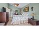 Relaxing bedroom with tropical themed decor, ceiling fan and a stylish wooden dresser at 614 14Th Ave. S # 47, Surfside Beach, SC 29575