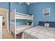 Stylish bedroom features a bunk bed, ceiling fan and beds with nautical themed decorations at 614 14Th Ave. S # 47, Surfside Beach, SC 29575