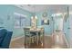 Bright dining room featuring coastal decor, dining table, and view to kitchen at 614 14Th Ave. S # 47, Surfside Beach, SC 29575