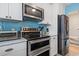 Updated kitchen featuring stainless steel appliances, modern countertops, and ample storage at 614 14Th Ave. S # 47, Surfside Beach, SC 29575