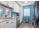 Well-lit kitchen with stainless steel appliances and charming backsplash, great for any home chef at 614 14Th Ave. S # 47, Surfside Beach, SC 29575