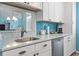 Spacious kitchen with stainless steel dishwasher and unique countertops, perfect for culinary enthusiasts at 614 14Th Ave. S # 47, Surfside Beach, SC 29575