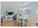 Open living room, dining room and kitchen with cozy seating, decor, and beachy accents at 614 14Th Ave. S # 47, Surfside Beach, SC 29575