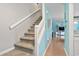 Stairway leads to the living area, filled with natural light and calming beach-themed decor at 614 14Th Ave. S # 47, Surfside Beach, SC 29575