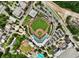 Birds-eye view of a baseball field with parking, tennis courts and green trees surrounding the stadium at 615 Carter Ln. # D6, Conway, SC 29526