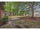 Spacious backyard with mature trees providing ample shade and privacy for outdoor activities at 615 Carter Ln. # D6, Conway, SC 29526