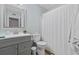 Clean and contemporary bathroom features a vanity, toilet, and shower with curtain at 615 Carter Ln. # D6, Conway, SC 29526