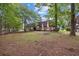 Brick building with large lawn area and mature trees in a quiet residential neighborhood at 615 Carter Ln. # D6, Conway, SC 29526