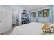 Comfortable bedroom with natural light, blue curtains, and a cozy atmosphere at 620 15Th Ave. S # 87, Surfside Beach, SC 29575
