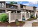 Charming townhome exterior with a private courtyard, stylish fence, and well-maintained landscaping for enhanced curb appeal at 620 15Th Ave. S # 87, Surfside Beach, SC 29575