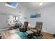 Comfortable living room featuring vaulted ceilings, skylight, hardwood floors, and cozy seating for relaxation and entertaining at 620 15Th Ave. S # 87, Surfside Beach, SC 29575