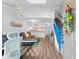 Bright living room with vaulted ceilings, skylight, modern furnishings, and a seamless flow into the open kitchen area at 620 15Th Ave. S # 87, Surfside Beach, SC 29575