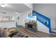 Cozy living room with stylish decor, hardwood floors, open staircase, and modern amenities, creating a warm and inviting atmosphere at 620 15Th Ave. S # 87, Surfside Beach, SC 29575