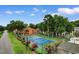 Community tennis court with mature trees and landscaping at 620 15Th Ave. S # 87, Surfside Beach, SC 29575