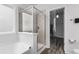 Bathroom featuring a glass shower, soaking tub and open door to walk-in closet at 628 Mccorkle Place, Conway, SC 29526
