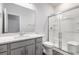 Bathroom featuring a modern vanity, a glass-enclosed shower, and sleek fixtures at 628 Mccorkle Place, Conway, SC 29526
